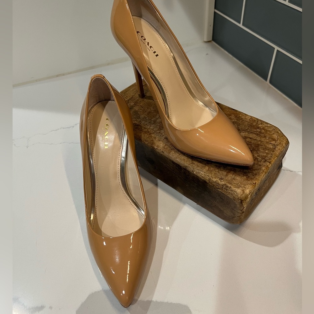 Size 7 Nude patent leather Coach stilettos
